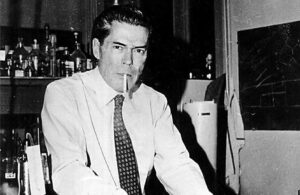 Jacques Monod in his biochemistry laboratory at the Pasteur Institute manipulating